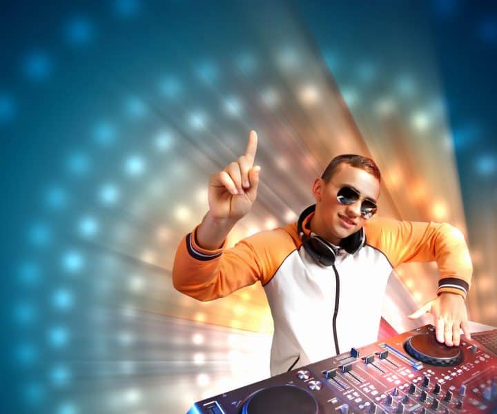 16906114 - dj with a mixer equipment to control sound and play music