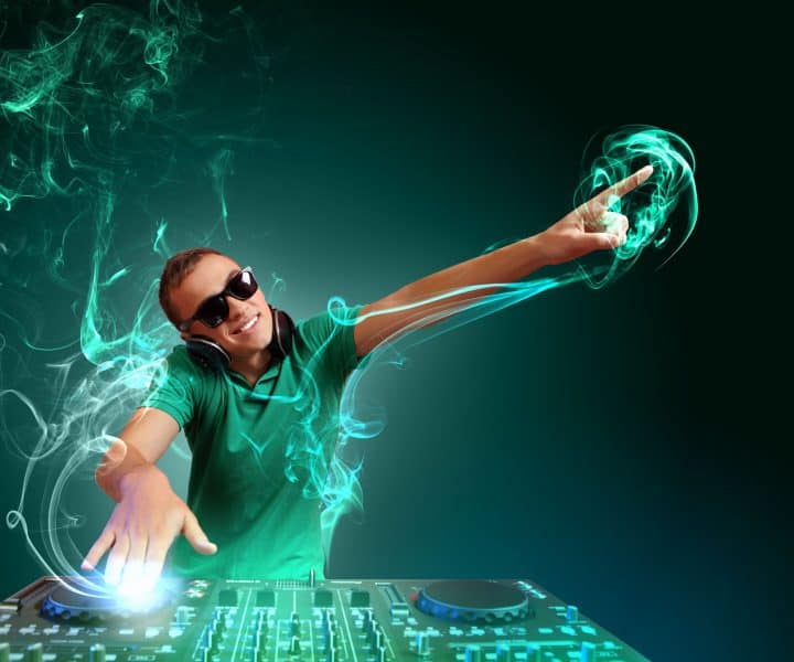 16908009 - dj with a mixer equipment to control sound and play music